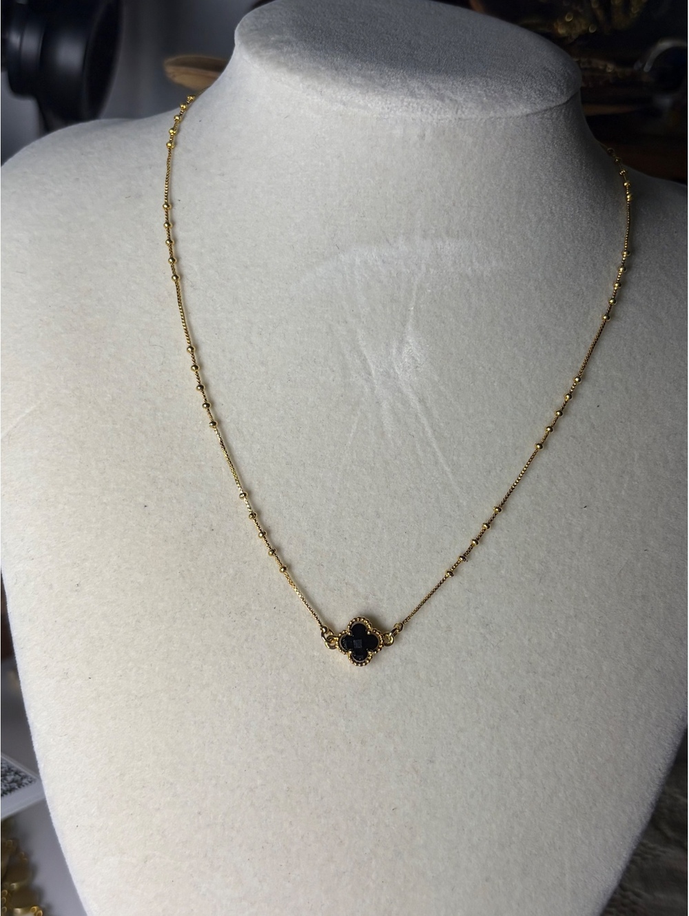 Gold Tone Necklace with Black Flower Pendant